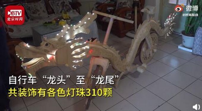 牛！辽宁男子用22000根雪糕棍做龙形自行车，还能“吞云吐雾”